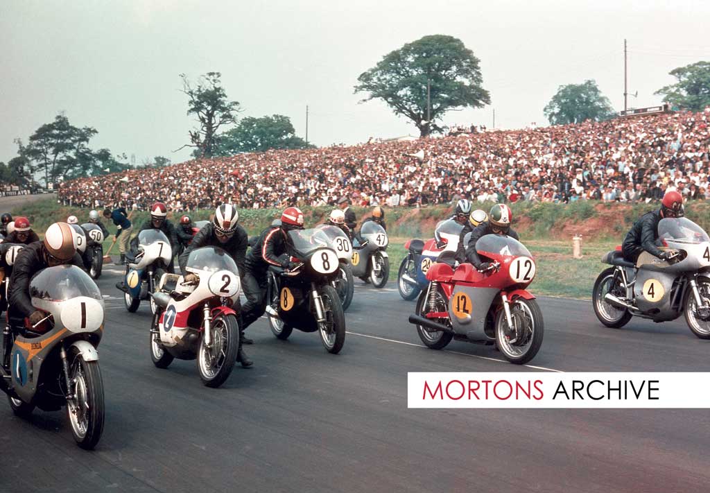 What a picture... taken at the Post TT in1968. Front row, from left Mike Hailwood (Honda), Phil Read (Yamaha), Rod Gould (Norton), Giacomo Agostini (MV) and John Cooper (Seeley). Also the star studded grid are 19 Pat Mahoney, 7 Percy Tait, 50 Percy May, 30 Barry Randle, 47 Brian Ball, 24 Rex Butcher and partially hidden behind 'Ago', Ray Pickrell.