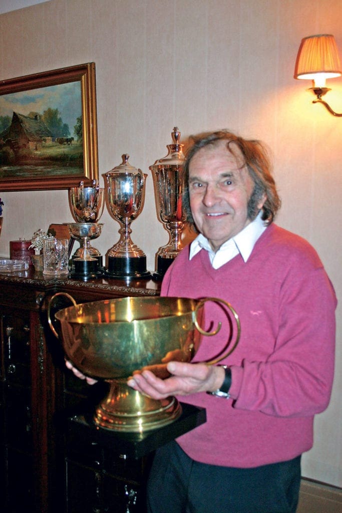 Percy Tait holding his trophy.