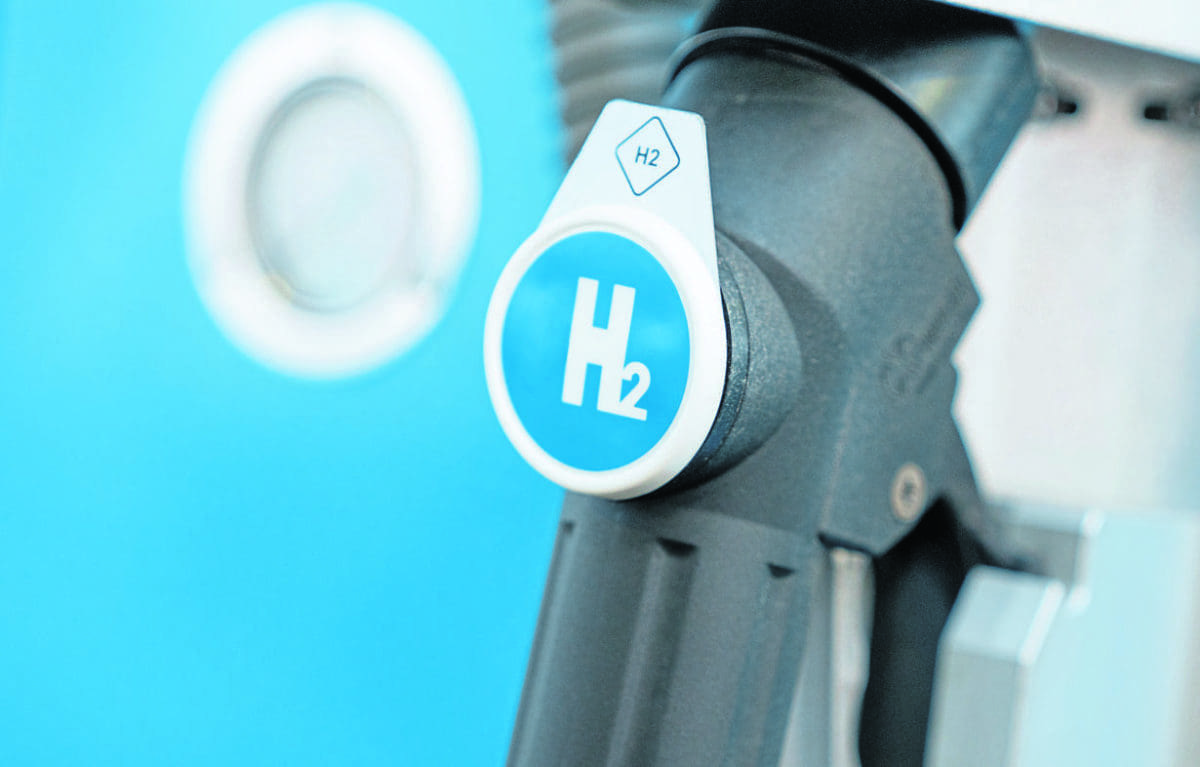 Hydrogen logo on gas stations fuel dispenser. h2 combustion engine for emission free eco friendly transport.