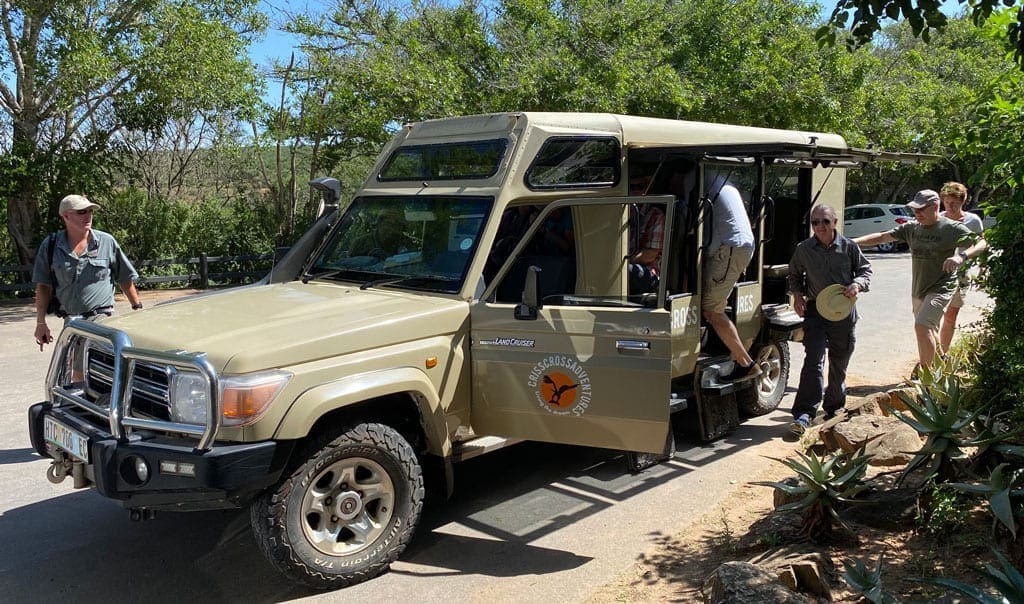 The group get ready to climb into their safari jeep.