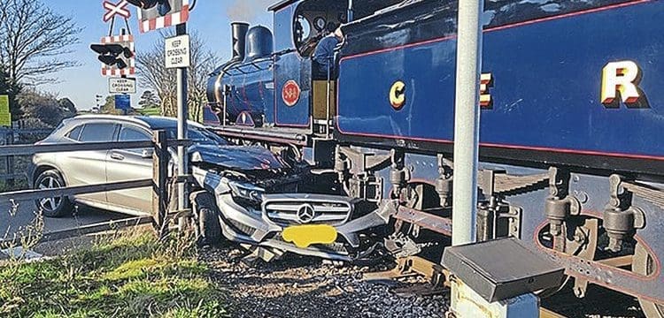 Car wrecked in collision with Y14 on level crossing