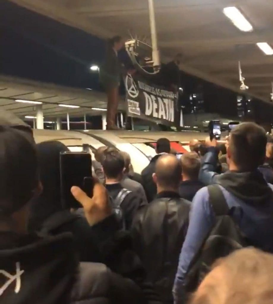 Ugly scenes as Extinction Rebellion protester is dragged from a Tube train.