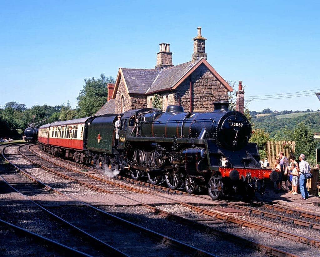 British Railways Standard Class 4 4-6-0 leaving Highley station on the Severn Valley Railway, Highley, Shropshire.
