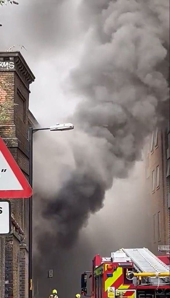Screen grab from the Twitter feed of @MissPokeno of a fire which is affecting London Bridge train services, which is in an arch under the railway in Union street, Southwark, London.