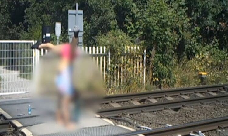 Warning as teenagers caught doing handstands at level crossing