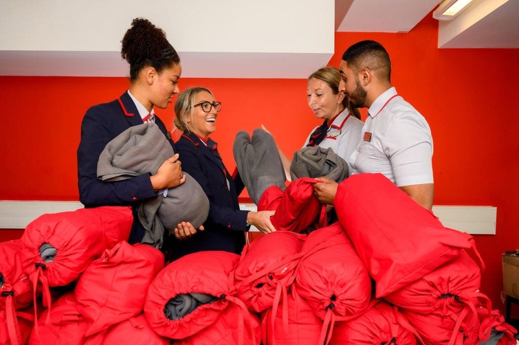 Scarves and blankets made from Virgin Trains staff's worn-out uniforms are being donated to people living on the streets.