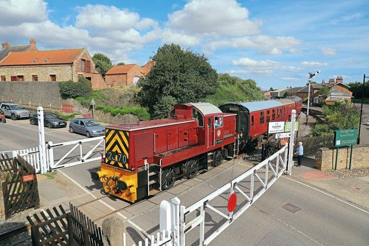 Class 14 diesel hydraulic No. D9523 eases over Bedale level crossing with a train towards Leyburn on July 16, 2017. Photo: Nigel Cockburn