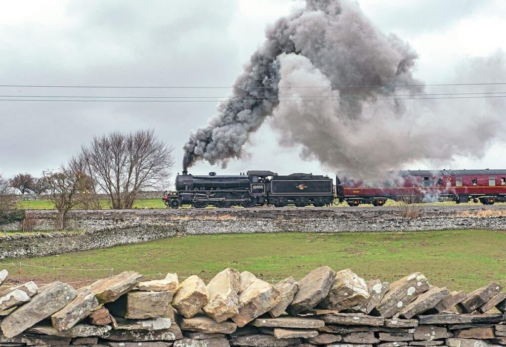 ‘K1’ 2-6-0 No. 62005 gets into its stride on March 21, 2015 with a train to Leyburn past the dry stone walls that typify the Wensleydale countryside. Photo: Dave Hewitt