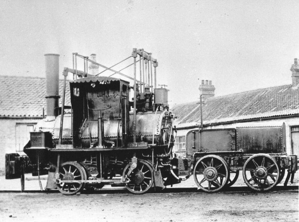 Post c1882 photograph of Lyon showing its driver’s shelter and replacement valve motion, together with its replacement tender.