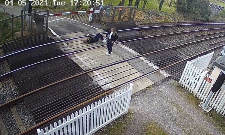 Network Rail appeal as girl caught on CCTV lying on railway tracks