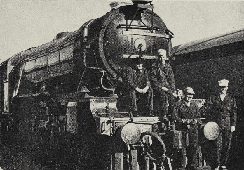 Author (left) posed on “Flying Scotsman” at Sharpe Army Depot, Lathrop, with the three people who helped him most in making final arrangements for the last American movement, to Oakland — Kathy Herd, Ernie Kirk and Pat Olsen. Photo: US Army