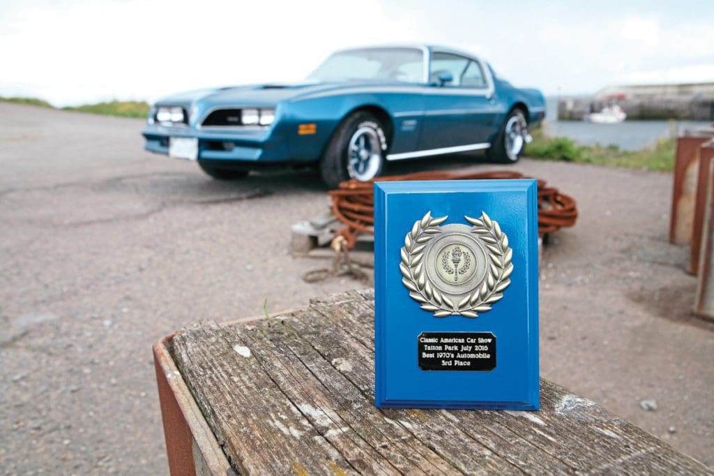 Classic American Car Show 3rd place award with Pontiac Firebird in background