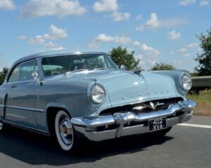 Pale blue 1953 Lincoln Capri two-door hardtop coupe car on road