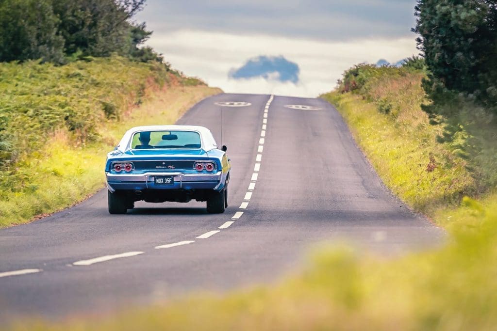 The Dodge Charger driving away from the camera