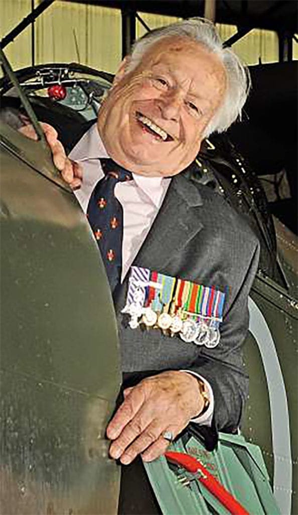 Geoffrey Wellum DFC in the cockpit of P7350 in October 2009, wearing the newly applied QJ-K code of his Battle of Britain era Spitfire I. RAF Coningsby Photographic Section/Crown Copyright