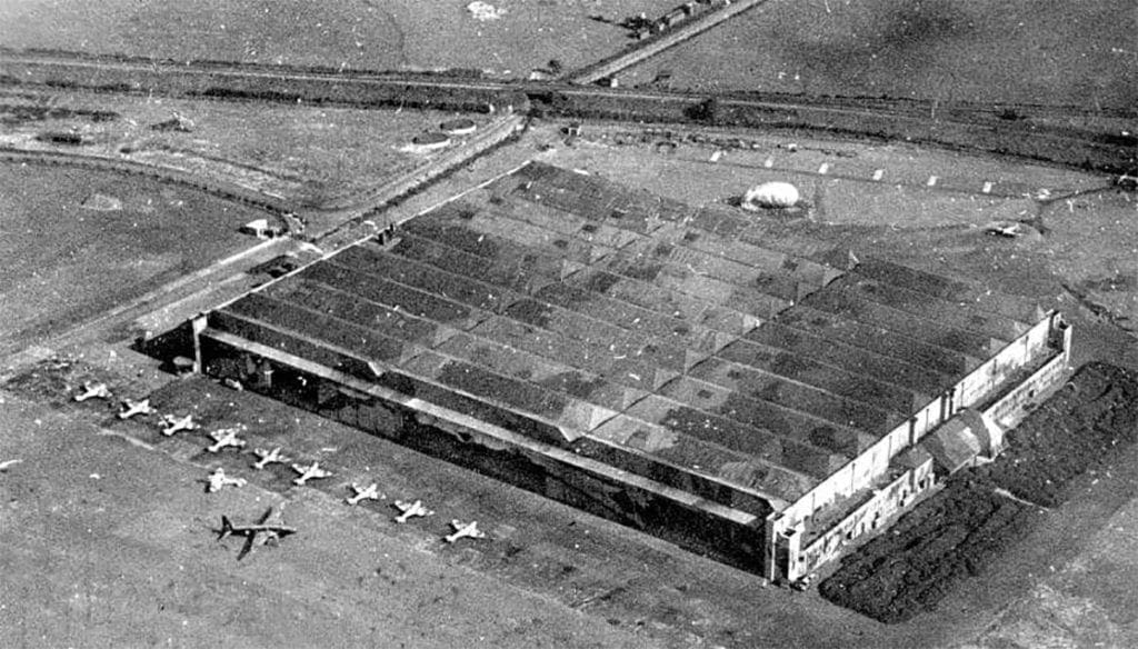 The flight test sheds at Castle Bromwich with Spitfires standing ready for flight. A repaired Wellington may also be seen.