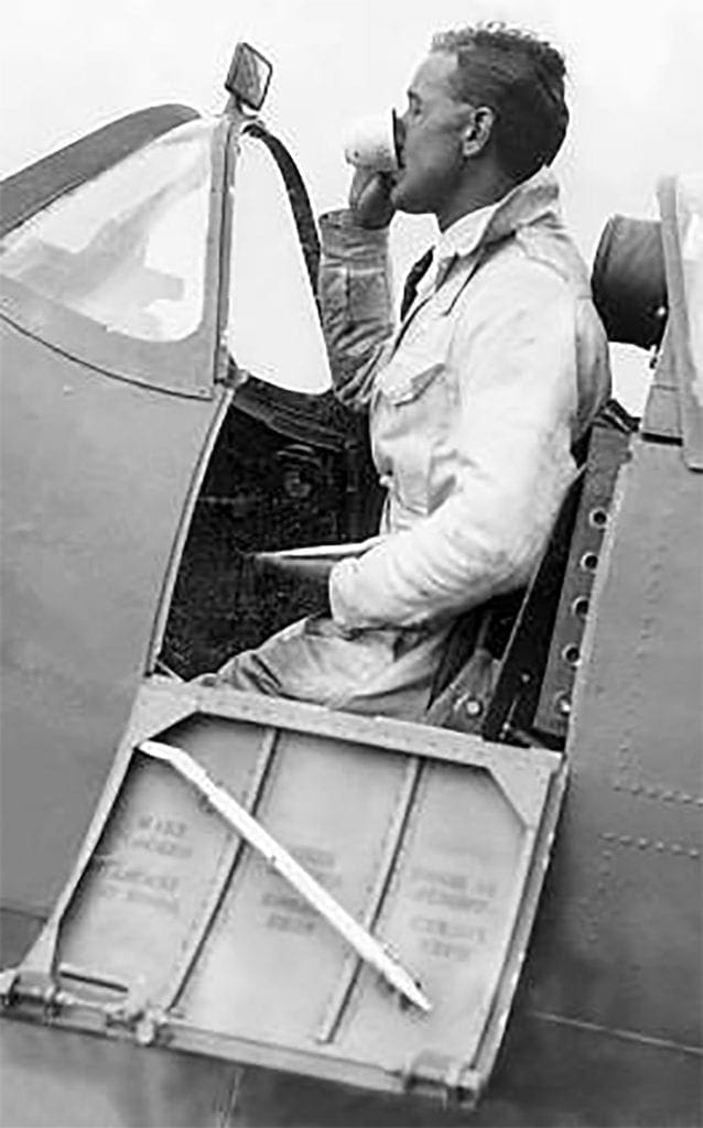 Sometimes there was no time to stop between test flights – Alex grabs a hasty cup of tea in the cockpit of a Spitfire at Castle Bromwich.