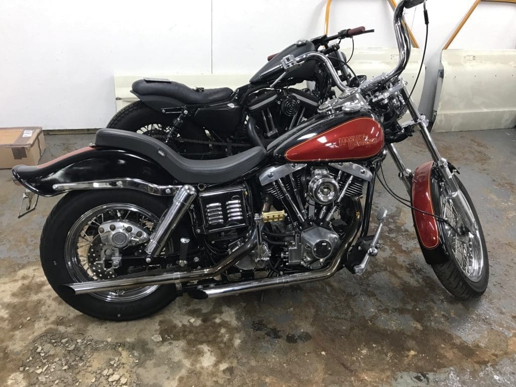 Red shovelhead parked in front of another bike