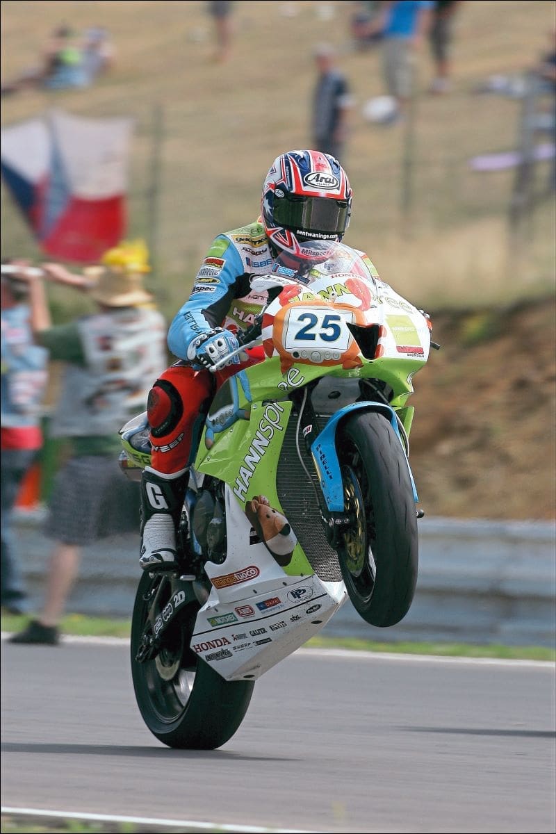 Brookes racing, doing a wheelie.