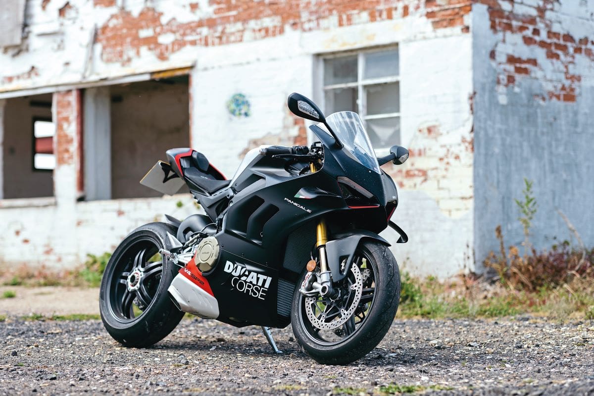 A shot of the Ducati Panigale V4 SP2 in front of a disused building.