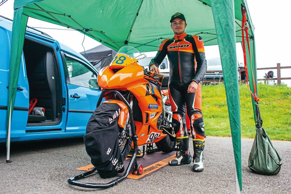 Tom Morris standing beside his Kawasaki ZX-6R