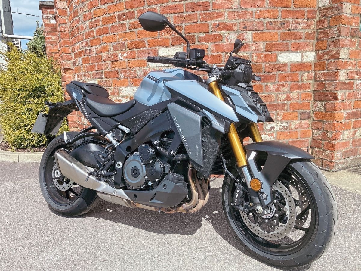 Suzuki GSX-S 1000 parked in front of a brick wall