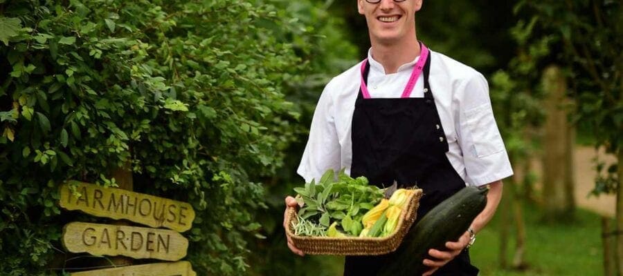 Chef gathering herbs and vegetables from the Kitchen Garden at Stowe. National Trust ImagesJohn Millar