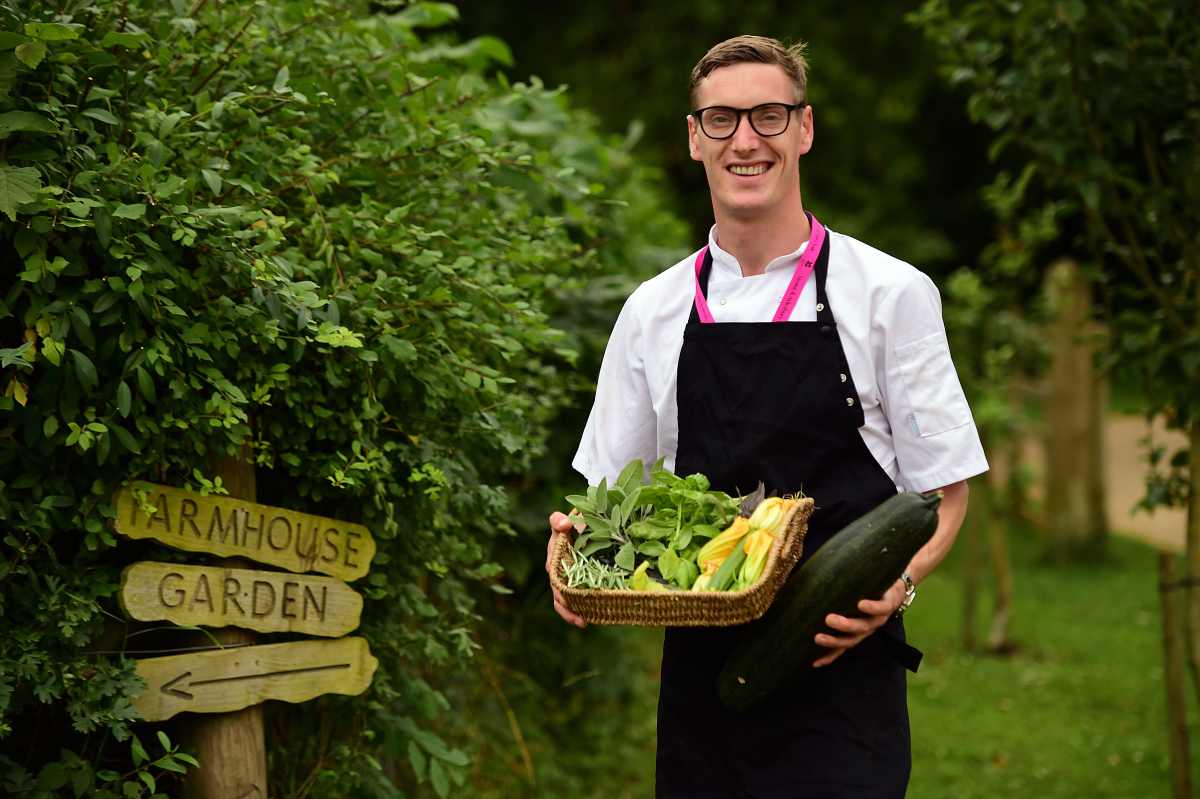 Chef gathering herbs and vegetables from the Kitchen Garden at Stowe. National Trust ImagesJohn Millar