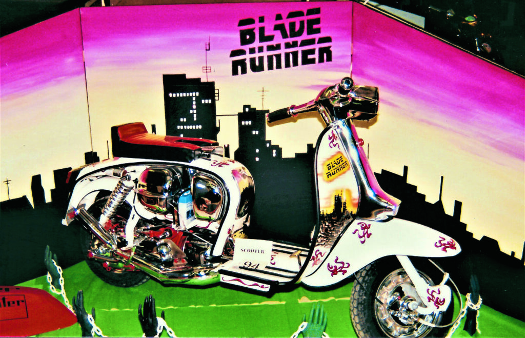 1) Imagine riding this scooter all the way to a custom show, carrying that display on the back!