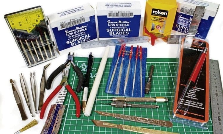 What are the essential tools I need for my workbench?
