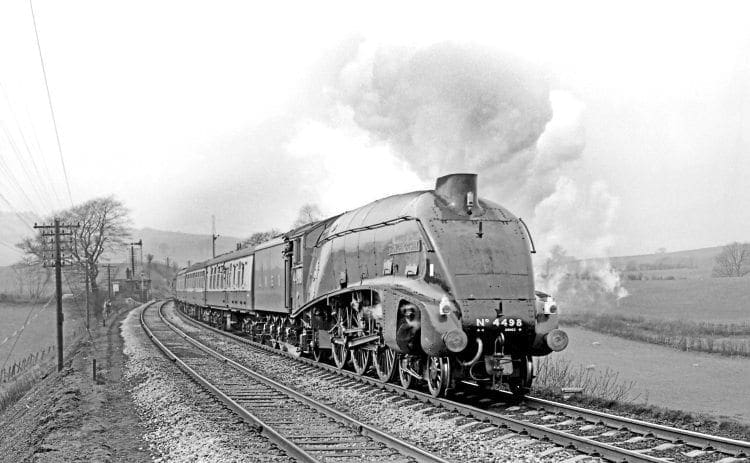 After overhaul at Crewe, LNER A4 Pacific No. 4498 Sir Nigel Gresley climbs Grayrigg bank on April 1, 1967 with its first railtour in preservation. MAURICE BURNS