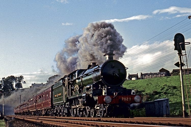 GWR 4-6-0 No. 7029 Clun Castle heads the LCGB ‘Castle to Carlisle’ tour past Culgaith, returning south over the Settle & Carlisle line on October 14, 1967. COLOUR-RAIL.COM 122350  