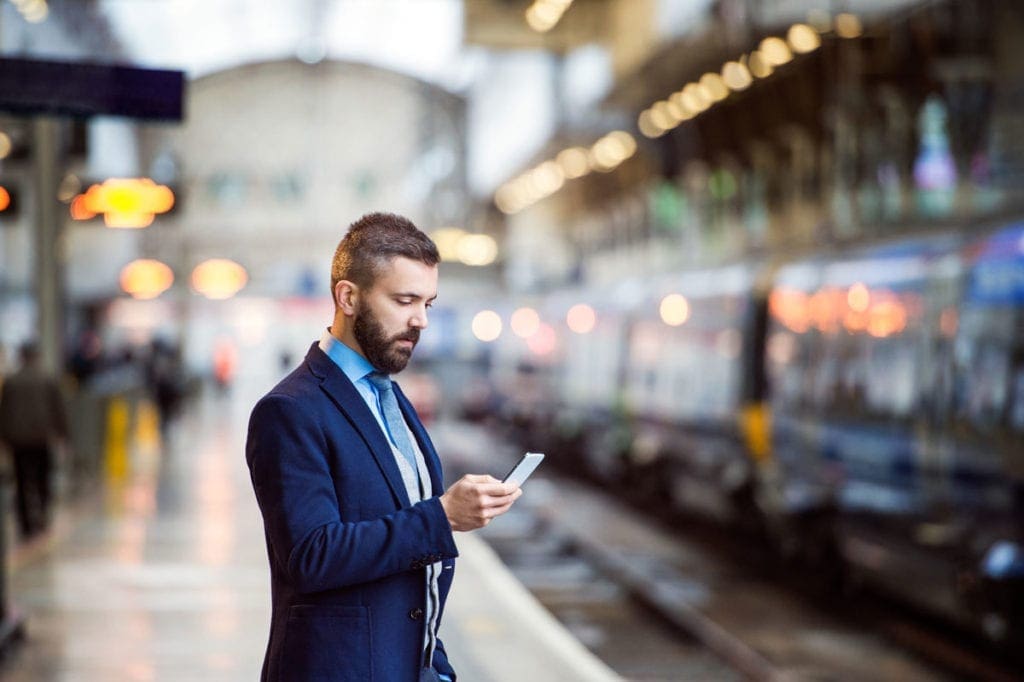 Man on phone at railway station