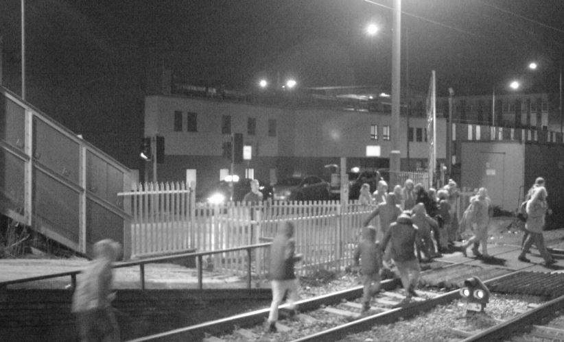 People-on-the-tracks-at-Grays-level-crossing-in-Essex