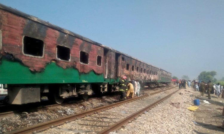 At least 73 dead in Pakistan train fire, police say