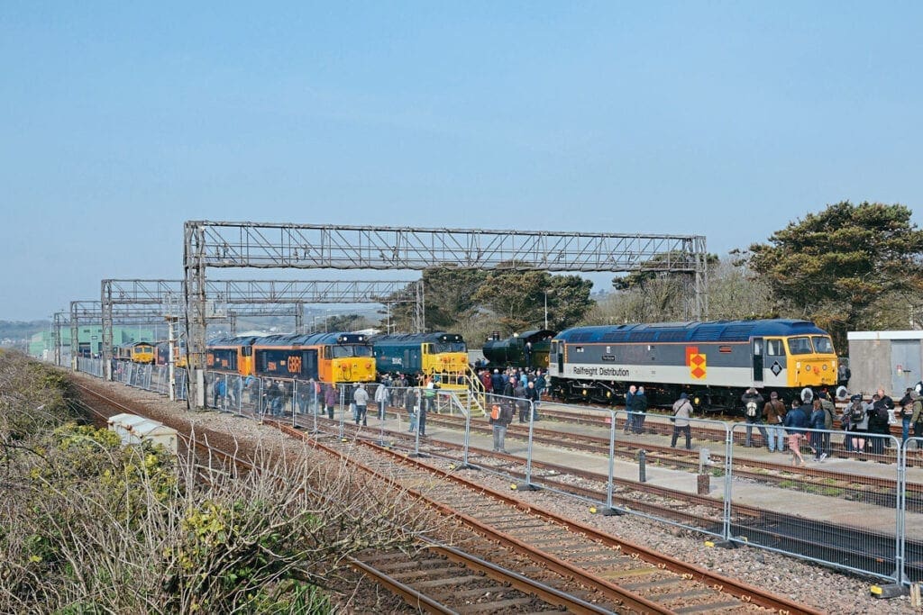 A general view of Long Rock looking west from the footpath along the adjacent sea wall, with the main line out of Penzance running this side of the temporary fence. Visible are Nos. 47306, 50007, 50049, 50042, steam loco No. 3205, 73107 and 66174. 