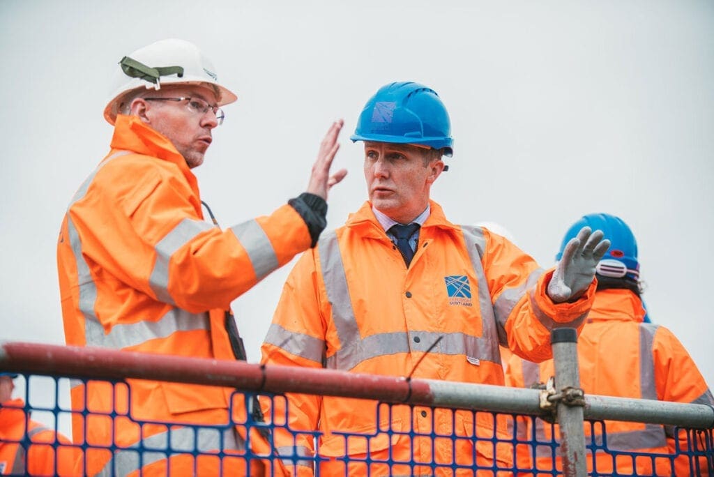 Cabinet Secretary for Transport, Infrastructure and Connectivity, Michael Matheson with Network Rail worker