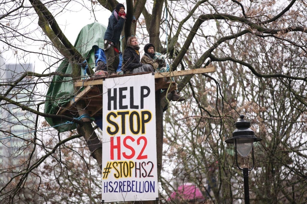 HS2 Rebellion protesters in a tree, part of an encampment in Euston Square Gardens in central London, where the protesters have built a 100ft tunnel network. 