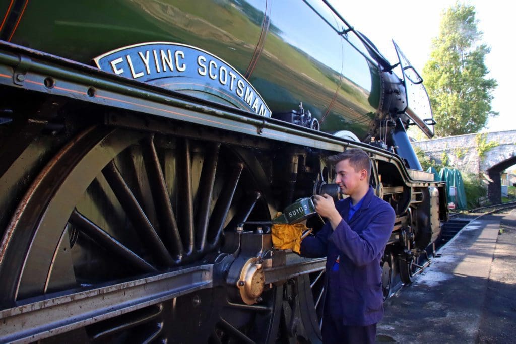 The Flying Scotsman being oiled by support crew fitter Ben Chapman.