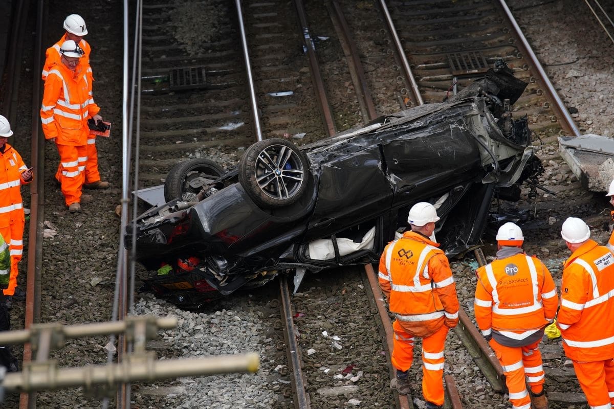 Major train line blocked after car crashed on to tracks