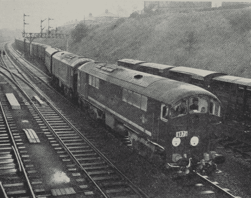 Two of the Metrovick type “2” locomotives on a test run with a freight train.