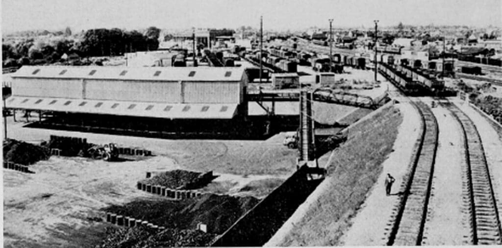 Panoramic view of the depot, looking west towards the passenger station, over the mechanised coal-handling plant, served by two sidings, and (beyond) the goods section.