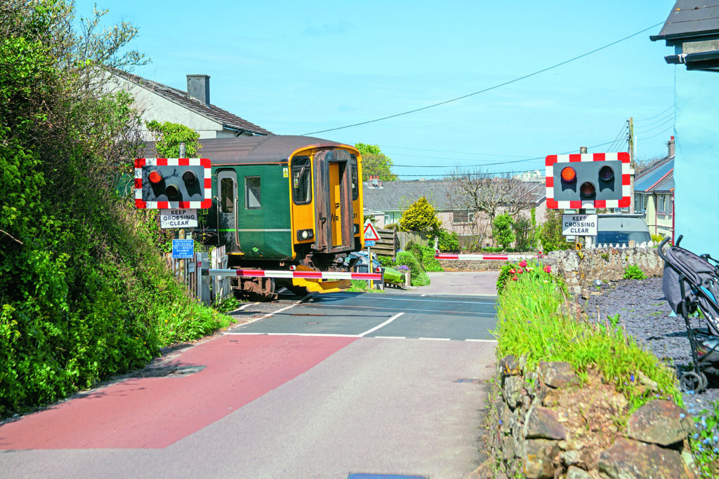 Sprinter 150221 passes Trencreek crossing on April 22, 2025; this crossing is now just a bridleway crossing.

