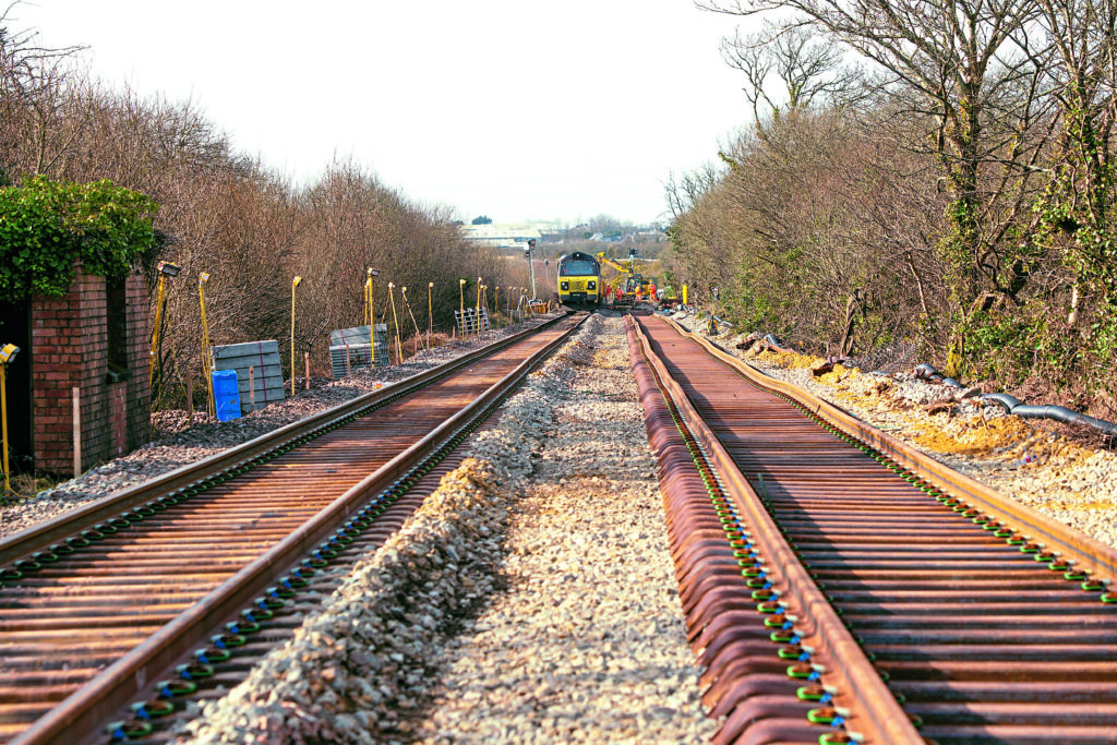 Colas 70810 and 70814 are engaged in laying the new loop at Tregoss on March 2, 2025.