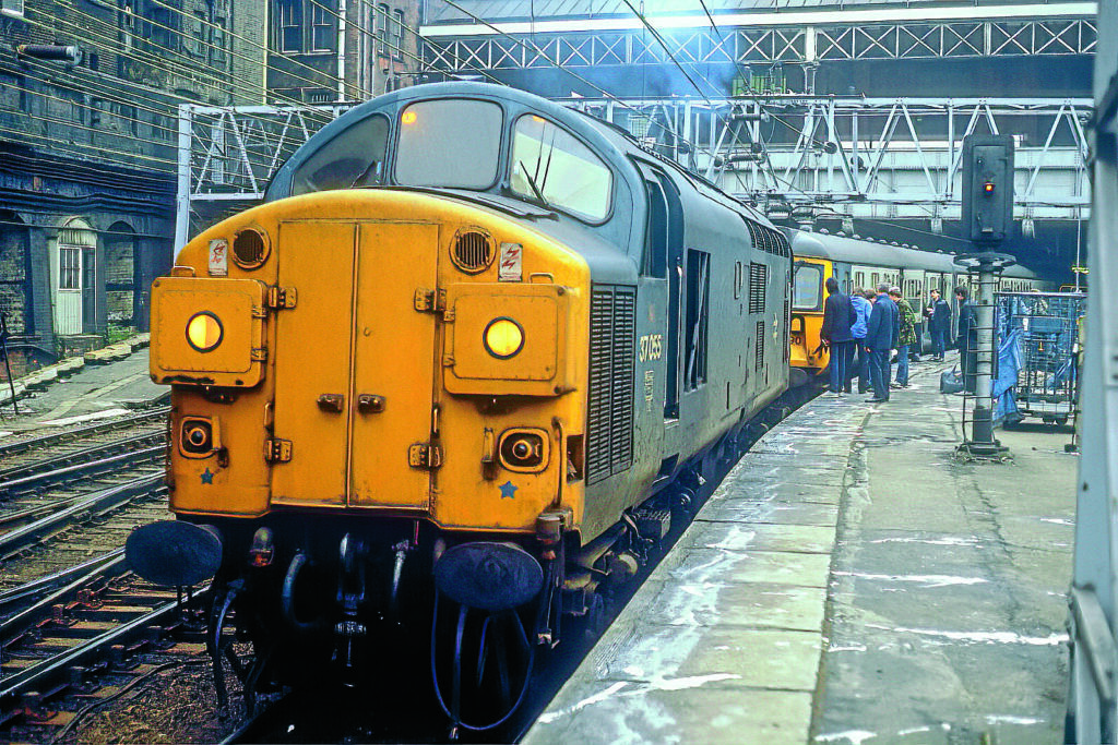 37055 waits to drag the Class 312 unit working 2F50, the 16.00 Liverpool St-Clacton, asfar as Ilford on February 16, 1986. Anthony Hicks