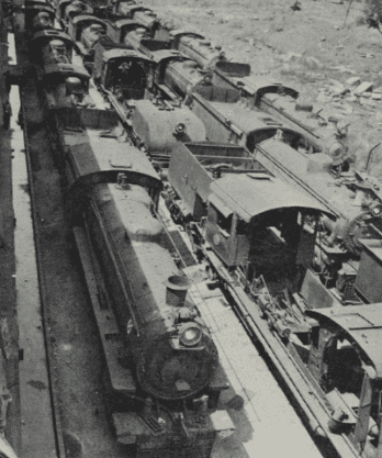 A line of “scrapped” and stored engines at Bulawayo. Several locomotives survive in such situations for many years after “scrapping”