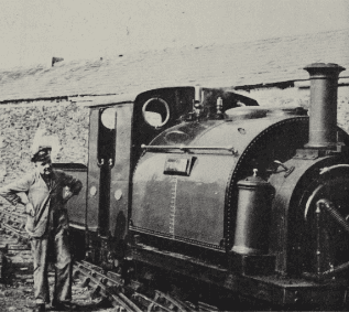 In active retirement on the Festiniog Railway, Bill Hoole looks on as 0-4-0 saddle-tank “Prince” shunts wagons at Glan-y-Mor Yard in September 1964