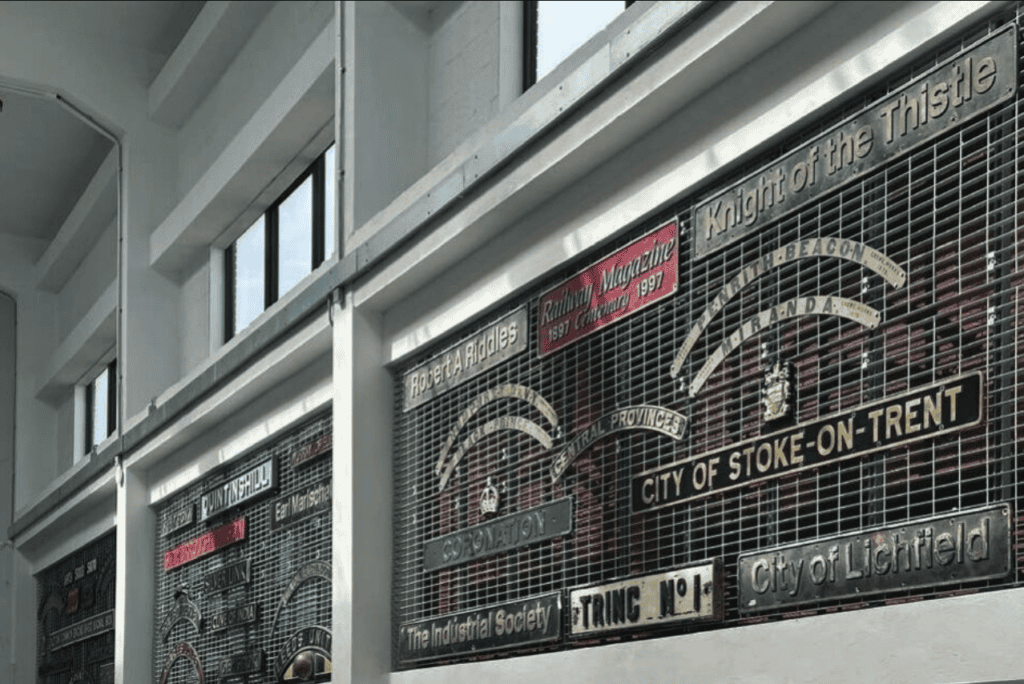 A lofty mezzanine entrance hall accommodates two small steam locomotives with four giant panels of railwayana incorporated into the side walls dominating the airy space. Each has an approximate regional theme, this being the London Midland panel.