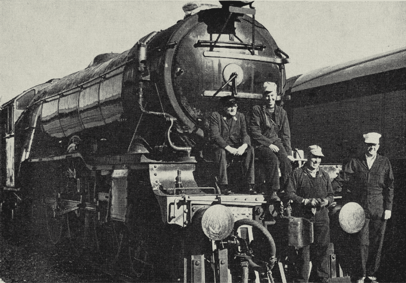 Author (left) posed on “Flying Scotsman” at Sharpe Army Depot, Lathrop, with the three people who helped him most in making final arrangements for the last American movement, to Oakland — Kathy Herd, Ernie Kirk and Pat Olsen.

Photo: US Army