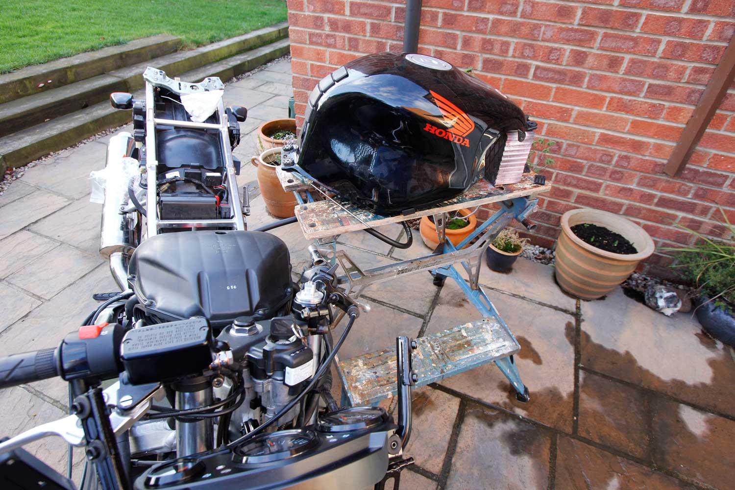 3 Pop your tank safely on a workbench, and connect it up with a long length of fuel pipe.